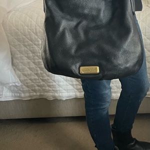 Marc Jacob’s Black leather shoulder/crossbody purse.